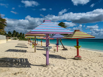 People at beach against sky