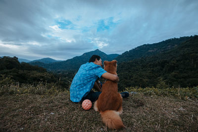 Rear view of friends on mountain