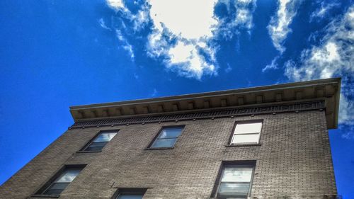 Low angle view of building against blue sky