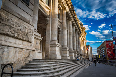 Rear view of man walking on staircase