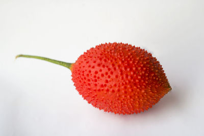Close-up of strawberry over white background