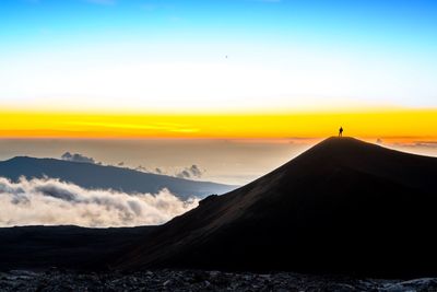 Scenic view of silhouette landscape against sky during sunset