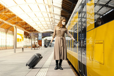 Woman standing in bus