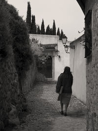 Full length of woman walking on steps