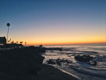 Scenic view of sea against sky at sunset