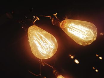 Low angle view of illuminated light bulb