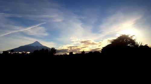 Silhouette mountains against sky during sunset