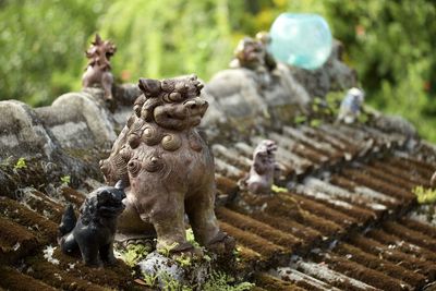 Shisa statues on the roof of a building in okinawa, japan. 