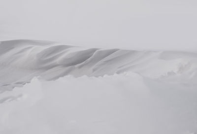 Full frame shot of snow on bed against sky