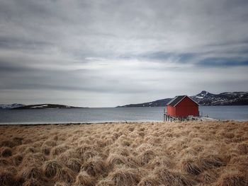 Landscape with a small red hut