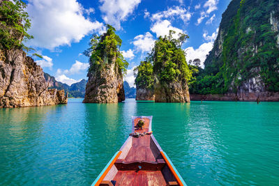 Panoramic view of boats in sea against sky