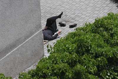 High angle view of man praying in his yard