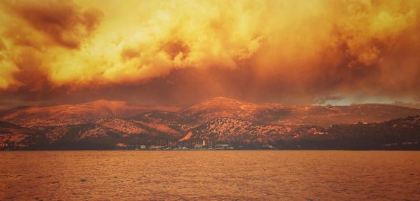 Scenic view of sea against sky during sunset