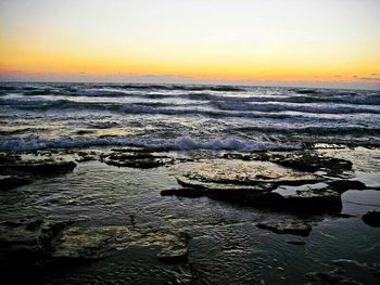 Scenic view of sea at sunset