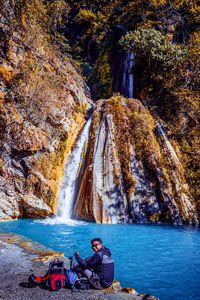 Scenic view of rock formation near waterfall