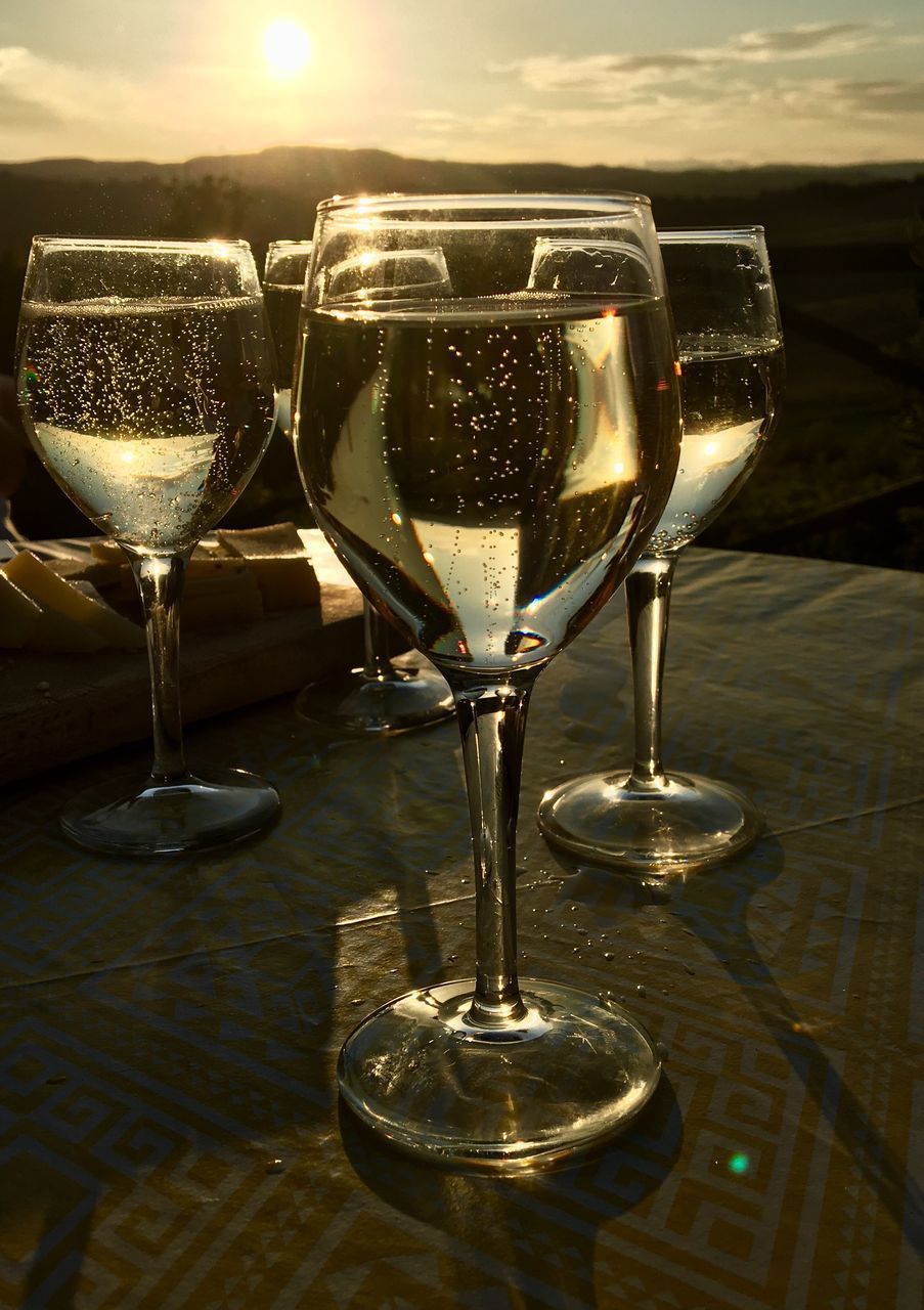 CLOSE-UP OF WINEGLASS ON TABLE