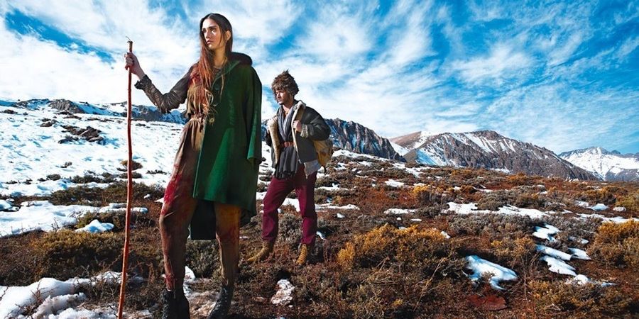 mountain, leisure activity, lifestyles, sky, snow, winter, full length, mountain range, vacations, cold temperature, casual clothing, scenics, young adult, landscape, tranquil scene, standing, tranquility, cloud - sky