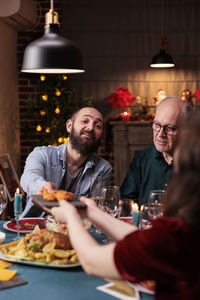 Portrait of woman having food at restaurant