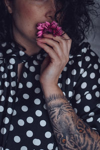 High angle view of woman hand holding flower