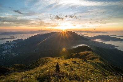 Scenic view of mountains against sky at sunset