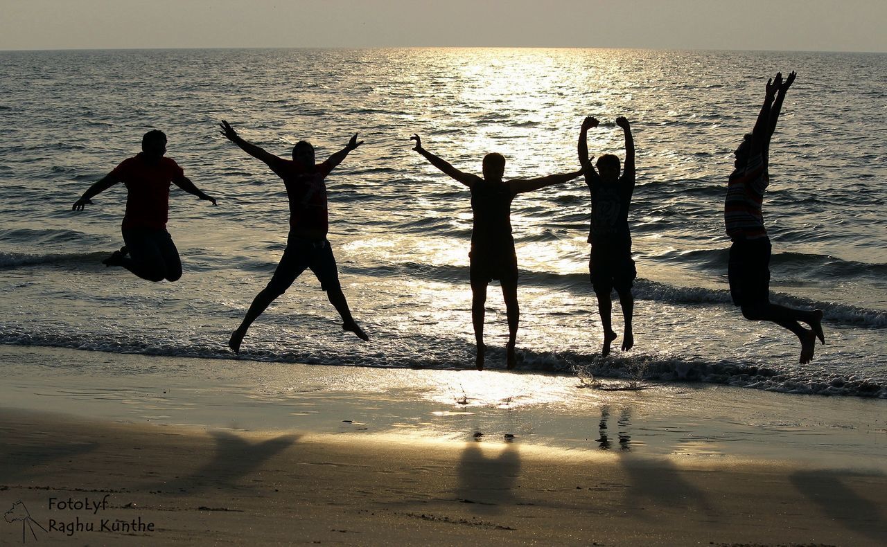 sea, beach, water, shore, horizon over water, sand, silhouette, leisure activity, lifestyles, men, vacations, wave, sunset, scenics, beauty in nature, nature, enjoyment, tranquil scene, tranquility