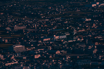 High angle view of illuminated buildings in city