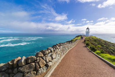 Scenic view of sea by building against sky