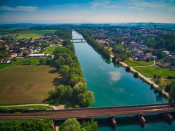 High angle view of bridge over river in city against sky