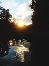 Scenic view of lake at sunset