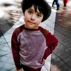 Portrait of boy standing outdoors