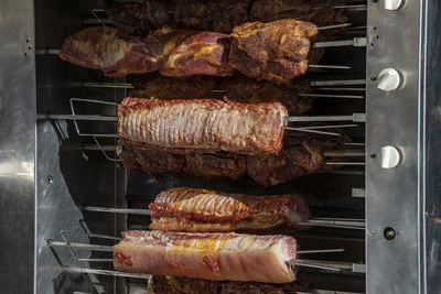 High angle view of meat on barbecue grill