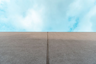View of wall against cloudy sky