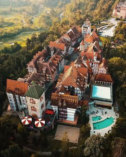 High angle view of houses and trees against sky