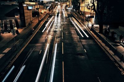 Cars on illuminated city at night