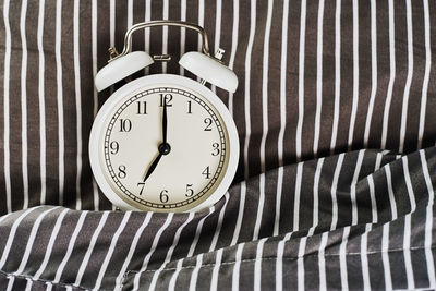 Close-up of clock on wall at home