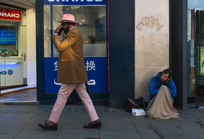 Full length of friends on street in city