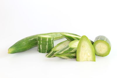 Close-up of green pepper against white background