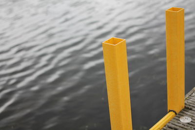 High angle view of yellow pier on lake