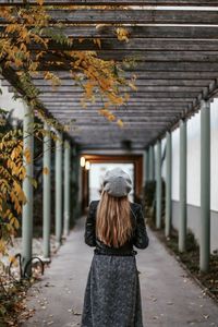 Rear view of woman walking outdoors