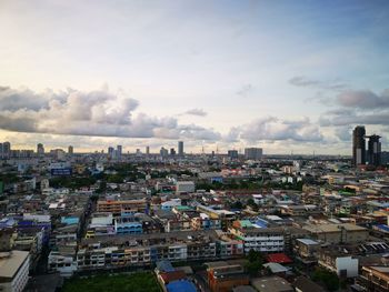 High angle view of buildings in city against sky