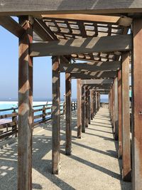 View of wooden bridge over sea