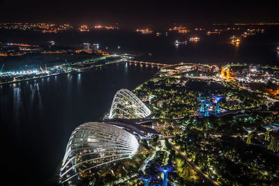 High angle view of illuminated buildings in city at night