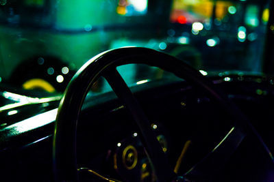 Close-up of car on road