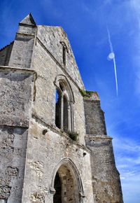 Low angle view of old building against sky