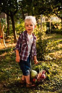 Full length portrait of boy eating food