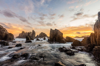 Scenic view of sea against sky at sunset