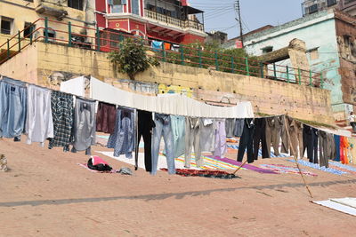 Clothes drying on clothesline outside building