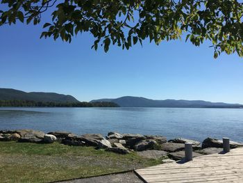Scenic view of lake with mountains in background