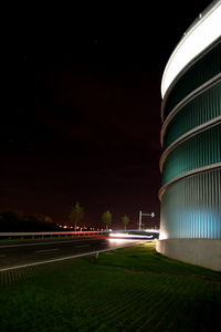 View of illuminated road at night