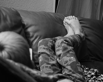 Boy relaxing on sofa at home